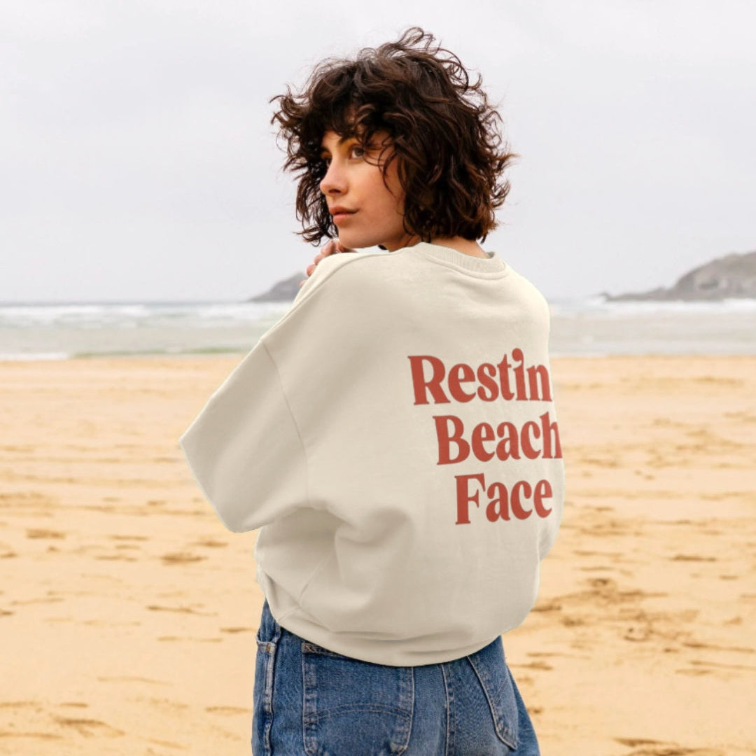 Harbour & Tide Resting Beach Face sweatshirt worn outdoors on beach