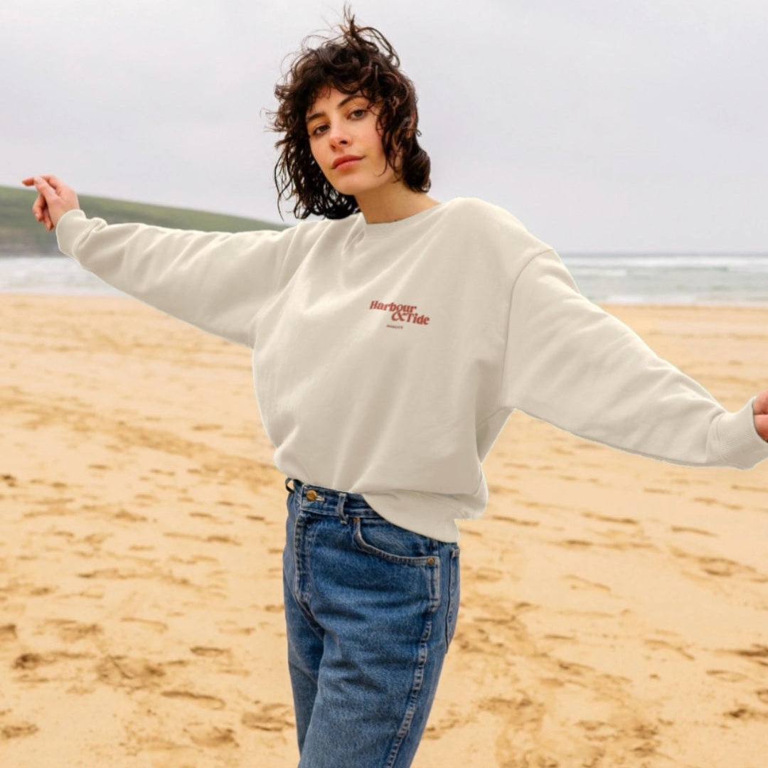 Harbour & Tide Resting Beach Face sweatshirt worn outdoors on beach