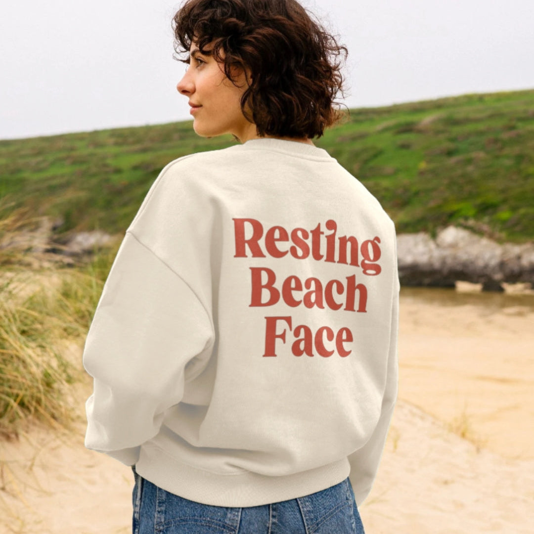 Harbour & Tide Resting Beach Face sweatshirt worn outdoors on beach