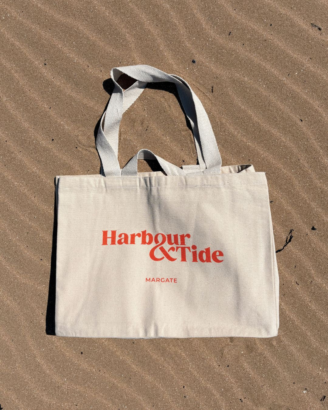 Spacious canvas beach bag with shoulder and grab handles