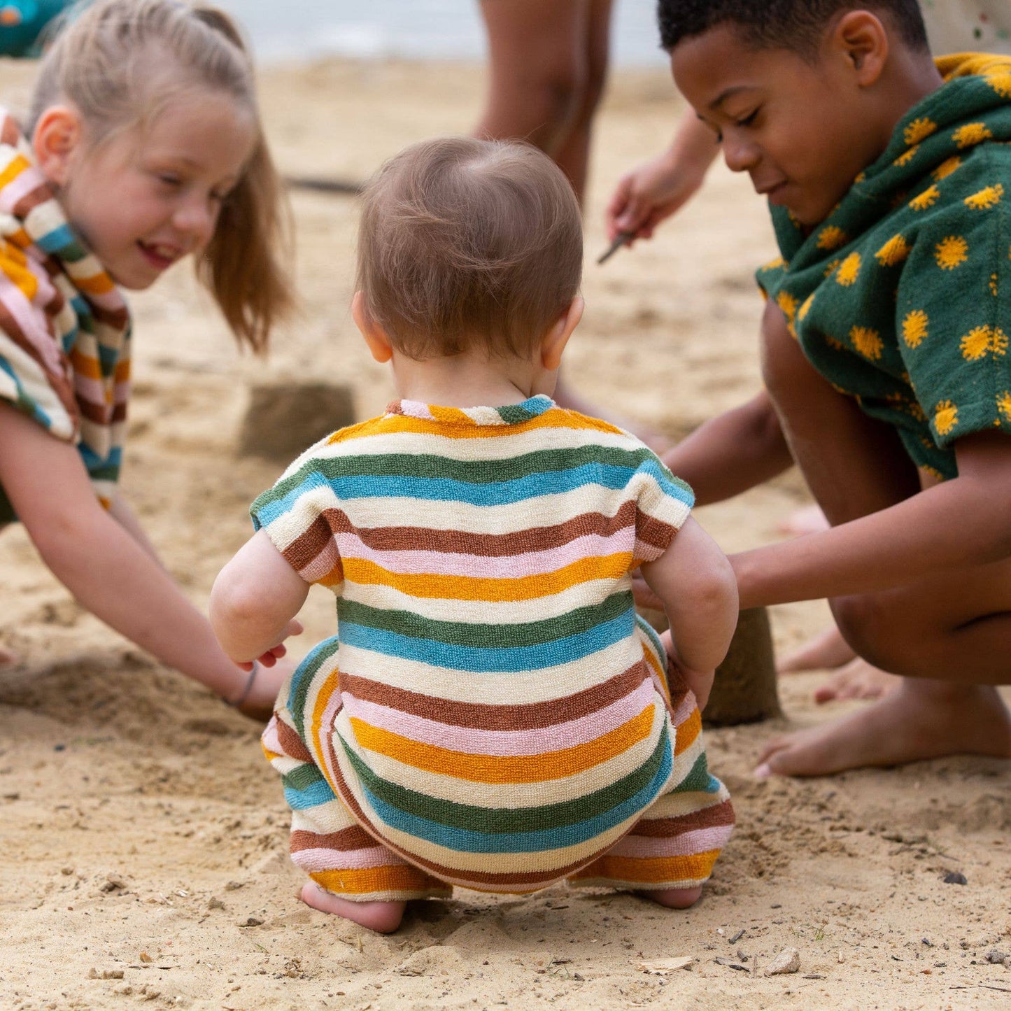 Little Green Radicals - Rainbow Striped Baby Towelling Romper: Rainbow Stripe - ages 2-4